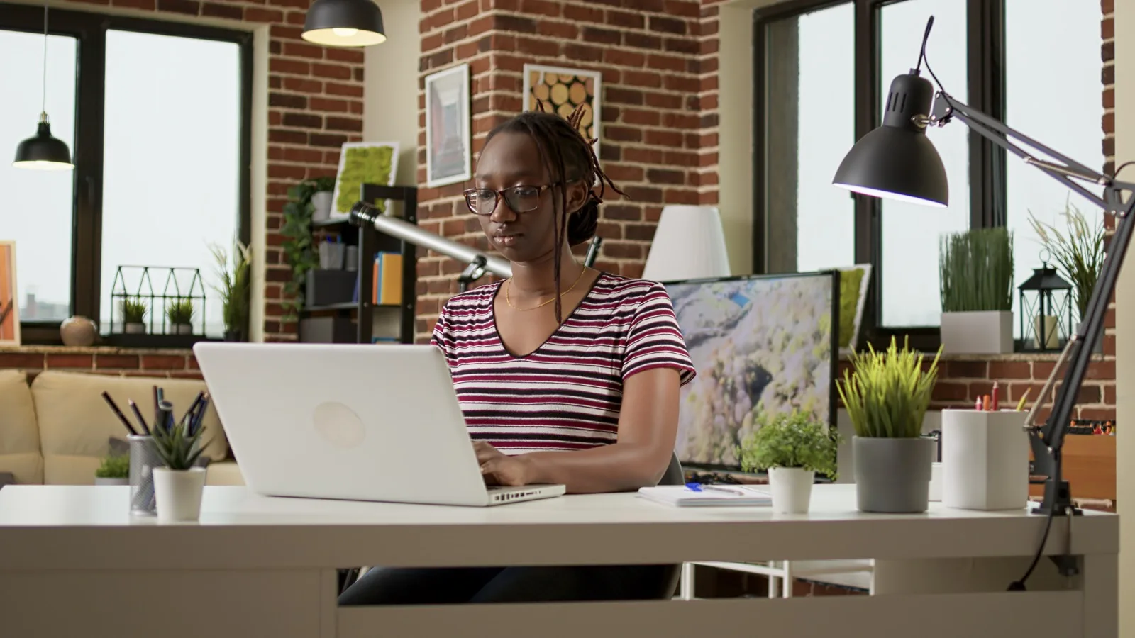 Focused teammate working from a desk setup